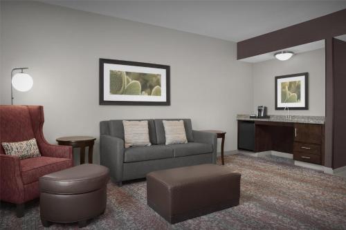 a living room with a couch and a chair at Hilton Garden Inn Gallup in Gallup