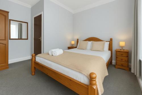 Postel nebo postele na pokoji v ubytování Shelford Lodge