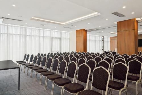 a room with rows of chairs in a conference room at Doubletree By Hilton Addis Ababa Airport in Addis Ababa