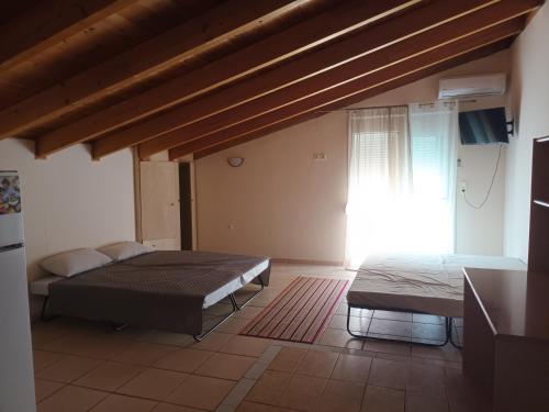 Postel nebo postele na pokoji v ubytování Hotel THERMOPULES