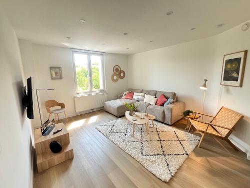 Posezení v ubytování Le Cocon des Tilleuls - Duplex 2 Ch - Parking inclus au pied du logement !