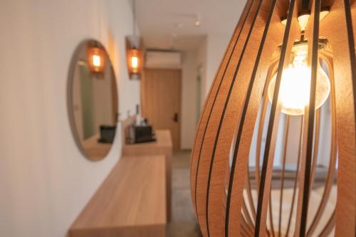 a hallway with a mirror and a wooden bench at Panorama Seaside in Mastichari