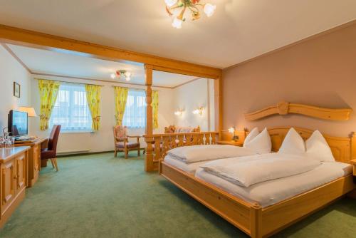 Postel nebo postele na pokoji v ubytování Posthotel Radstadt