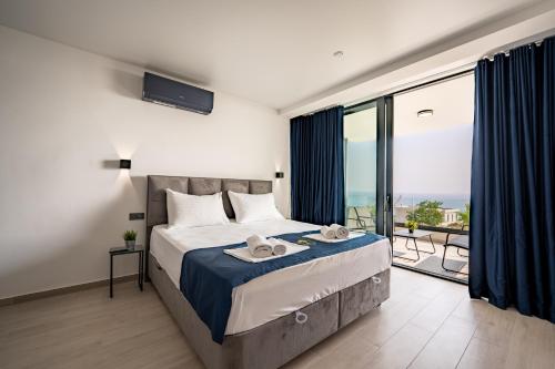 a bedroom with a bed with a view of the ocean at Villa Dubai in Novalja