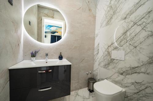 a bathroom with a sink and a mirror at Villa Dubai in Novalja