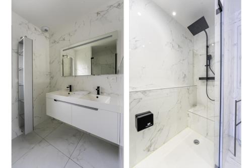 ein weißes Badezimmer mit Waschbecken und Spiegel in der Unterkunft Villa climatisée avec piscine et stationnements in Vendargues