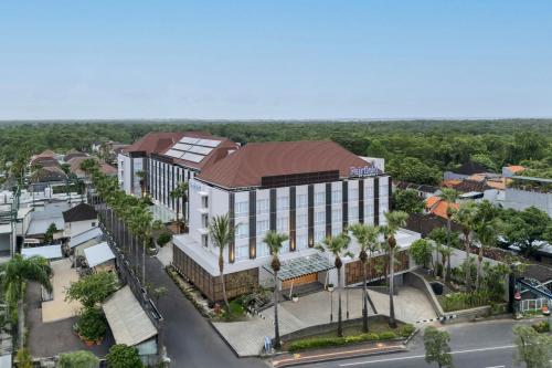 an overhead view of a building in a city at Fairfield by Marriott Bali Kuta Ngurah Rai in Kuta
