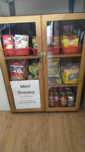 a cabinet filled with lots of food at Two-Bedroom at San Remo Oasis in Cebu City