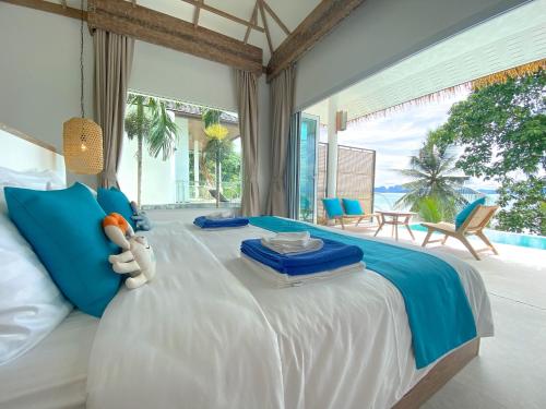 Katil atau katil-katil dalam bilik di Purana Resort Koh Yao Noi - SHA Extra plus