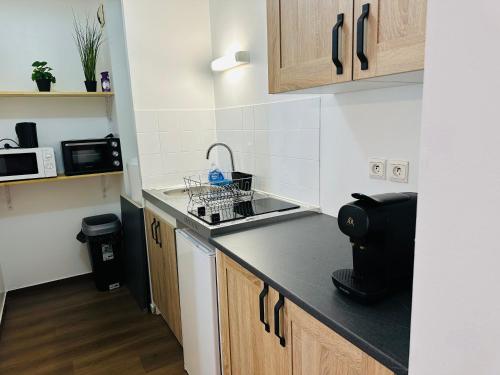 Η κουζίνα ή μικρή κουζίνα στο Appartement de la Gare