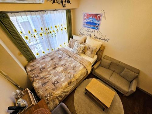 Letto o letti in una camera di Cozy room Airport and Disneyland direct bus