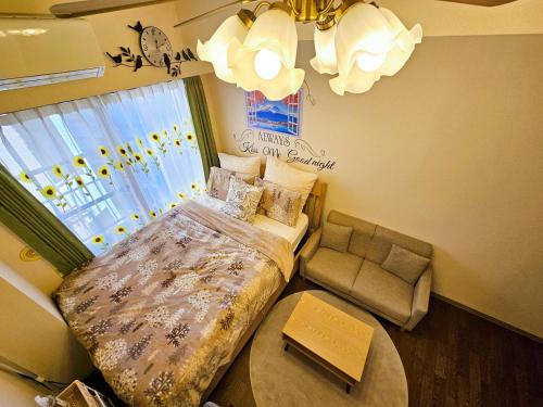 Letto o letti in una camera di Cozy room Airport and Disneyland direct bus