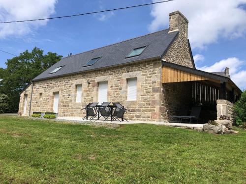 a brick building with two sculptures in front of it at Maison Albert 