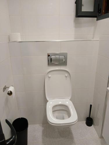 a bathroom with a white toilet in a stall at Seaview carabonita in Al Hoceïma