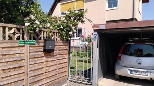 a car parked in a garage next to a house at Ferienwohnung Eichweg in Bad Sooden-Allendorf