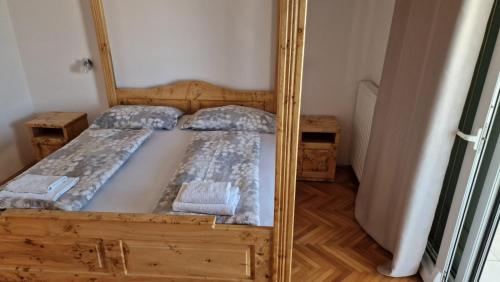 Ένα ή περισσότερα κρεβάτια σε δωμάτιο στο Apartman Weiß House