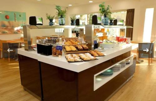 a buffet line with a lot of food on display at Hotel Pyr private studio in Fuengirola