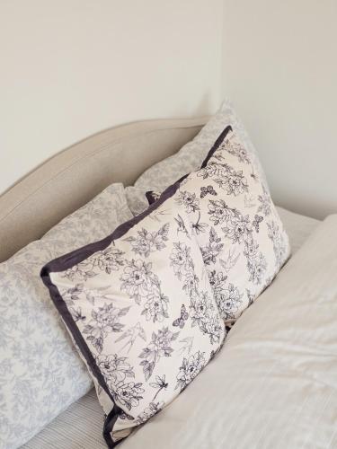 a pillow sitting on top of a bed at La dolce vita Giove apartment in Giove