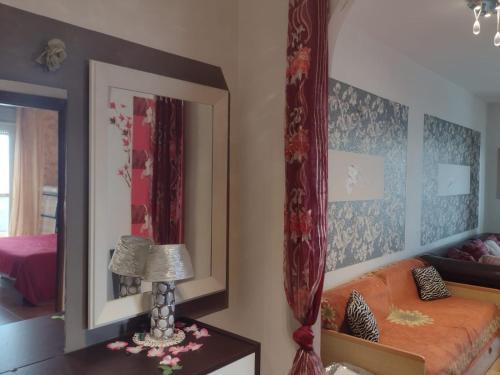 a bedroom with a bed and a mirror at Casa sul mare in Alba Adriatica