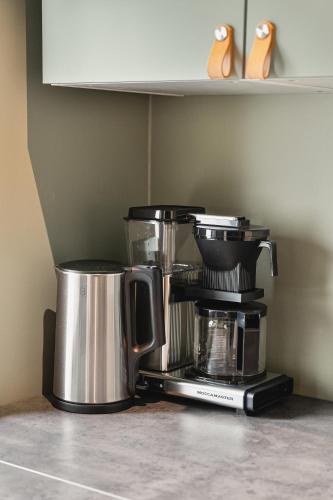 a coffee maker on a counter in a kitchen at Odda Trolltunga Atmosphere in Odda