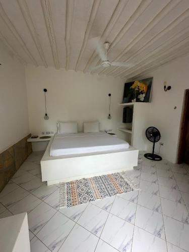 Ένα ή περισσότερα κρεβάτια σε δωμάτιο στο Cactus lodge Zanzibar