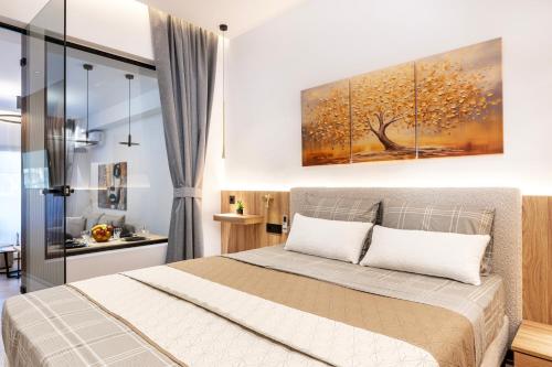 Postel nebo postele na pokoji v ubytování Serenity Apartments