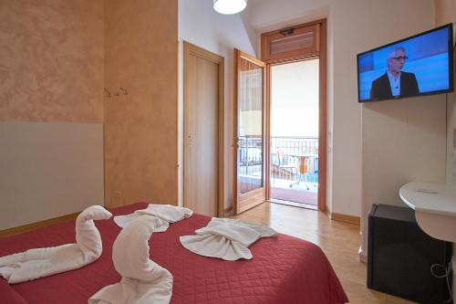 Postel nebo postele na pokoji v ubytování Bel Sole Guest House