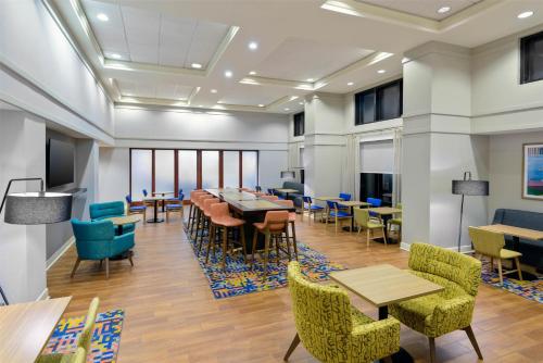 a conference room with tables and chairs and tablesktop at Hampton Inn & Suites Pensacola/Gulf Breeze in Gulf Breeze
