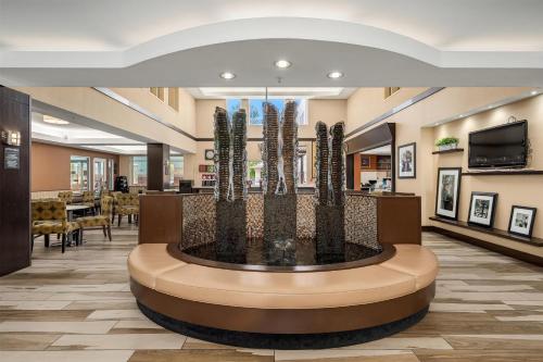 a lobby with a fountain in the middle of a building at Hampton Inn & Suites Seattle North/Lynnwood in Lynnwood