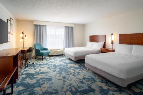 a hotel room with two beds and a desk at Hampton Inn & Suites Knoxville-Turkey Creek Farragut in Knoxville