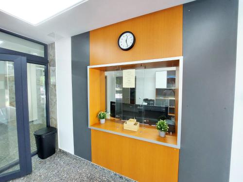 an office with a clock on a wall at Wesendorf Residenz Premium Lounge in Wesendorf