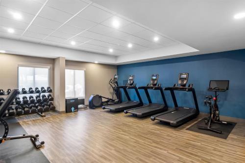 a gym with a row of treadmills and machines at Hampton Inn Jacksonville Ponte Vedra in Jacksonville Beach