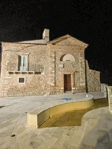 a large stone building at night with at Casa di Adele in Brittoli