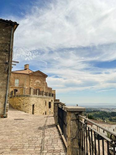 an old building with a balcony on top of it at Casa di Adele in Brittoli