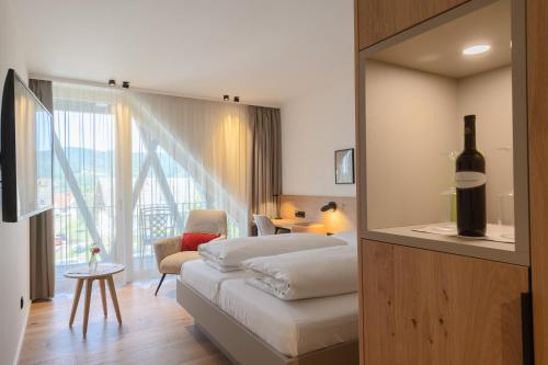 Postel nebo postele na pokoji v ubytování Hotel Die Alm