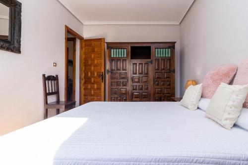 Postel nebo postele na pokoji v ubytování Encantadora casa con jardín cerca de Santillana del Mar