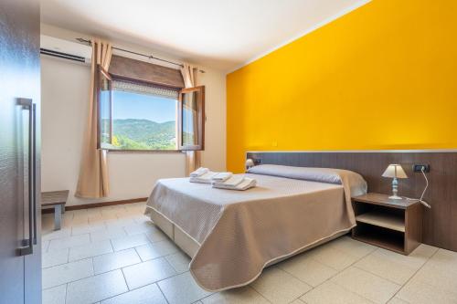 Postel nebo postele na pokoji v ubytování Hotel Marina