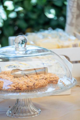 a cake in a glass dish on a table at Hotel Marina in Badesi