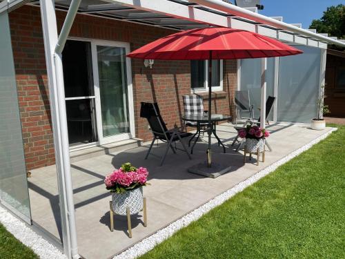 Zahrada ubytování moderne 2-Zimmer-Wohnung mit überdachter Terrasse