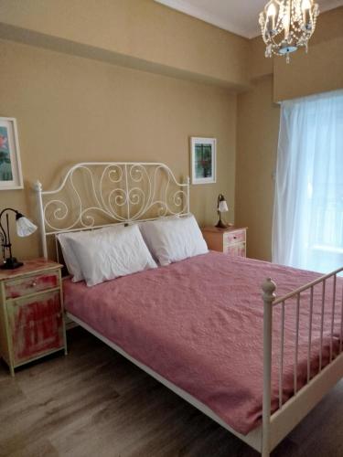 a bedroom with a large bed with a purple blanket at Kookoo in Athens