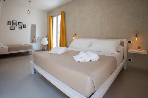 Giường trong phòng chung tại Da Zia Manny