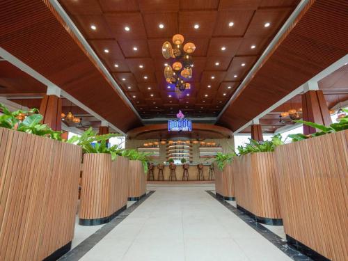 a hallway of a resort with a chandelier and a building at Wonderland Suites and Resort in Sihanoukville