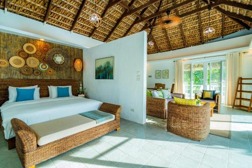 Ένα ή περισσότερα κρεβάτια σε δωμάτιο στο Pearl Bay Villas Private Resort