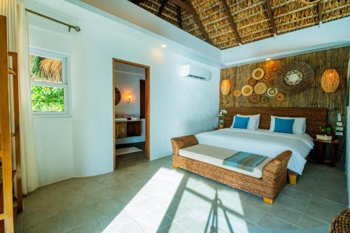 Ένα ή περισσότερα κρεβάτια σε δωμάτιο στο Pearl Bay Villas Private Resort