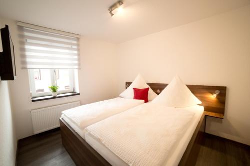 Ένα ή περισσότερα κρεβάτια σε δωμάτιο στο Hotel Gasthaus Roter Ochsen