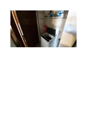 a kitchen with a stove and a refrigerator at Relax by the sea in Piriápolis