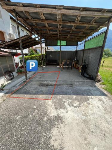 a parking lot with a pergola in a house at Stanojkov 2 in Bovec