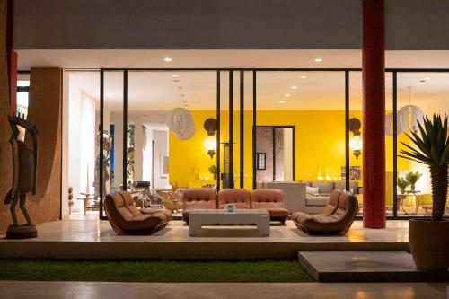 a lobby with a lot of chairs and a table at Dar Syada Boutique Hotel Marrakech in Marrakech