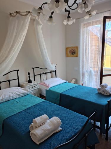 Ένα ή περισσότερα κρεβάτια σε δωμάτιο στο Interno Sette, mare e lago a pochi minuti
