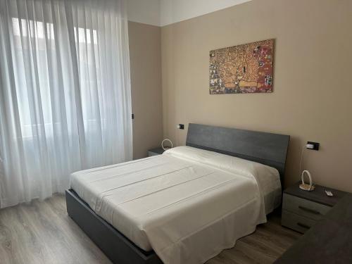 Postel nebo postele na pokoji v ubytování Appartamento Lucia, Lago di Como, Dongo
